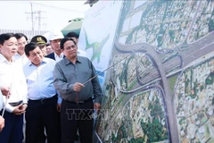 Prime Minister Pham Minh Chinh inspects the construction of Tan Van intersection of the Ho Chi Minh City's Ring Road 3 through Binh Duong province. (Photo: VNA)