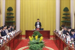 State President Luong Cuong chairs a meeting with the Presidential Office on December 31 to review its December performance and set key duties for January 2026. (Photo: VNA)