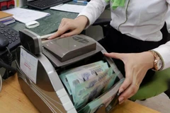 Under a 2025 outlook report released recently, experts from Vietcombank Securities Company (VCBS) predict the US dollar index (DXY) may remain at a high level and may last longer than expected.(Photo: VNA)