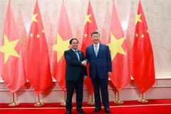 Vietnamese Prime Minister Pham Minh Chinh (L) and General Secretary of the Communist Party of China (CPC) Central Committee and President of China Xi Jinping at their meeting on August 31. (Photo: VNA)