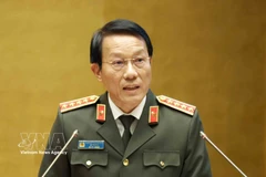 General Luong Tam Quang, Politburo member and Minister of Public Security, speaks at the national conference in Hanoi on February 7. (Photo: VNA)