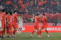 Vietnam (red) defeat Myanmar 5-0 on December 21 to advance to the ASEAN Cup semi-finals. (Photo: VNA)