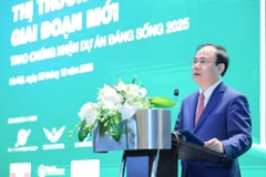Deputy Minister of Construction Nguyen Van Sinh addresses a forum on real estate market on December 25 (Photo: VNA)