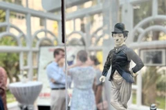 A figurine of Charlie Chaplin is among the notable items featured in the exhibition ‘Charlie Chaplin: Echoes of a Legend’. (Photo: VNA)