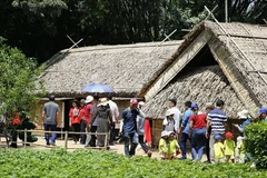 People visit President Ho Chi Minh's house in Sen village, Nam Dan district, central province of Nghe An. (Photo: VNA)