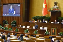 Minister of Education and Training Nguyen Kim Son answers questions raised by legislators. (Photo: VNA)