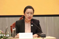 Manola Meuangmani, Director General of the Foreign Exchange Management Department under the Bank of the Lao PDR, speaks at the conference (Photo: VNA)