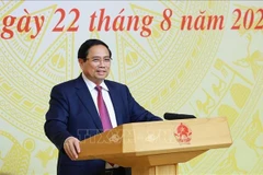 Prime Minister Pham Minh Chinh speaks at the coneference on August 22, 2025. (Photo: VNA)