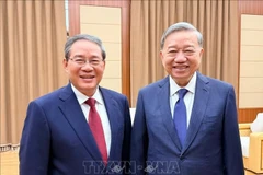 General Secretary of the Communist Party of Vietnam (CPV) Central Committee To Lam (right) meets with Chinese Premier Li Qiang, who is also a member of the Standing Committee of the Political Bureau of the Communist Party of China (CPC) Central Committee, in Pyongyang on October 9. (Photo: VNA)