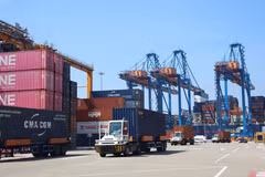 Container trucks operate at Gemalink International Port, part of the Cai Mep Port system in Ho Chi Minh City. (Photo: VNA)