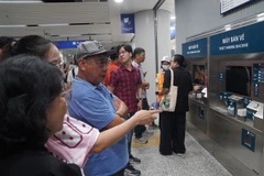 Passengers wait to buy tickets on Metro Line 1 in HCM City (Photo: VNA)