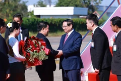 Prime Minister Pham Minh Chinh arrives in Vientiane on December 2 morning. (Photo: VNA)