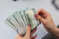 E-transfers from 1,000 USD at Vietnam’s IFC must be reported, according to the SBV's draft decree. (Photo: VNA)