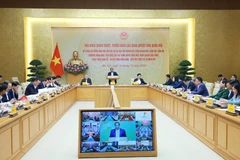 Prime Minister Pham Minh Chinh chairs the conference on December 30 (Photo: VNA)