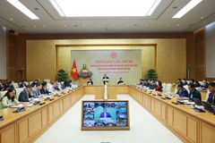 Prime Minister Pham Minh Chinh chairs the 28th meeting of the national steering committee for combating IUU fishing on December 30. (Photo: VNA)