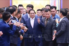 Prime Minister Pham Minh Chinh chairs a dialogue with the business community in Hanoi on May 31 (Photo: VNA)