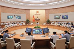 Participants at the meeting (Photo: VNA)