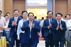 Prime Minister Pham Minh Chinh (centre) at the conference (Photo: VNA)