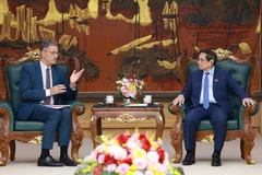 Prime Minister Pham Minh Chinh receives French Ambassador to Vietnam Olivier Brochet on May 13. (Photo: VNA)