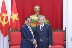 Party General Secretary To Lam (R) receives Gautam Adani, Chairman of the Adani Group of India in Hanoi on July 30. (Photo: VNA)