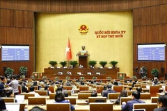 The National Assembly votes to pass the revised Law on Judicial Expertise. (Photo: VNA)