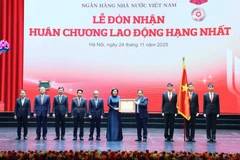 PM Pham Minh Chinh bestows the first-class Labour Order on the SBV (Photo: VNA)