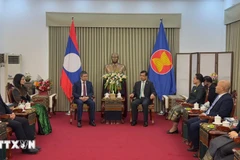 A delegation from the Vietnamese Embassy in China visits the Lao Embassy on December 1 to convey congratulations on the 50th National Day of Laos. (Photo: VNA)