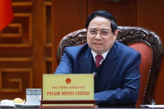 Prime Minister Pham Minh Chinh chairs a January 26 meeting in Hanoi of the standing government members and the Standing Board of the Government Party Committee on reports and submissions to competent authorities regarding nuclear power projects. (Photo: VNA)