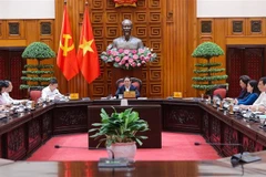 PM Pham Minh Chinh chairs the meeting with permanent Government members and representatives from ministries and agencies on September 12. (Photo: VNA)