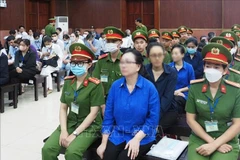 Defendant Truong My Lan (first row, centre) and accomplices at the trial. (Photo: VNA)