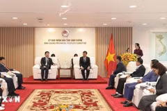 At the working session (Photo: VNA)