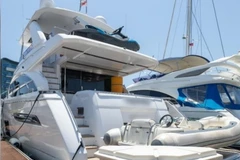 The assets tied to the Cambodia scam syndicate include a yacht, 11 cars and multiple bottles of liquor. (Photo: Singapore Police Force)