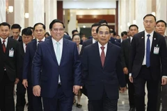 Prime Minister Pham Minh Chinh meets with Bounthong Chitmany, Permanent member of the Lao People’s Revolutionary Party (LPRP) Central Committee’s Secretariat and State Vice President of Laos in Vientiane on January 10. (Photo: VNA)