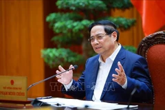 Prime Minister Pham Minh speaks at the working session. (Photo: VNA)
