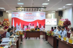 An overview of a seminar gathering overseas Vietnamese community's ideas for national development in Ho Chi Minh City on the occasion of the 50th anniversary of National Reunification (Photo: VNA)