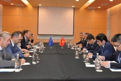 The meeting between National Assembly Vice Chairman Le Minh Hoan and Wouter Beke, chair of the European Parliament delegation at AIPA-46, in Kuala Lumpur on September 18. (Photo: VNA)