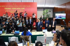 PM Pham Minh Chinh visits the press centre serving the 14th National Party Congress (Photo: VNA)