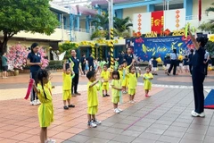 Students participating in outdoor activities at a HCM City kindergarten in District 3. The city promotes building happy schools. (Photo: VNA)