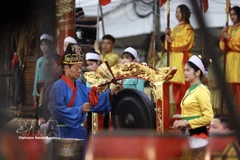 The ritual of praying for a good harvest is performed at the festival. (Photo: VNA)