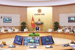 Prime Minister Pham Minh Chinh chairing the Government's meeting on October 5 (Photo: VNA)