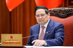 Prime Minister Pham Minh Chinh speaks at the meeting (Photo: VNA)