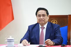 Prime Minister Pham Minh Chinh speaks at the phone talks with Angolan President Joao Manuel Goncalves Lourenco on March 16. (Photo: VNA)