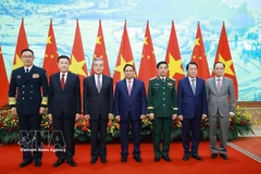 Prime Minister Pham Minh Chinh (centre) and the Vietnamese and Chinese ministers of foreign affairs, national defence and public security at the meeting in Hanoi on March 16. (Photo: VNA)