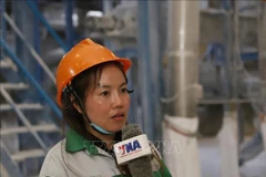 Thiphakesone Saysangoan, a worker at Sepon Tapioca Starch Processing Sole Co., Ltd. – a Vietnamese-invested company, in an interview with the Vietnam News Agency's correspondents in Laos. (Photo: VNA)