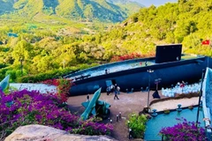 A full-scale submarine model is placed on a hillside at the Nha Trang Impression Submarine Tourist Area. (Photo: nhandan.vn)