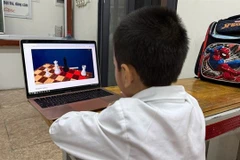 There should be a concerted effort to protect children in the cyber space. (Photo: VNA)