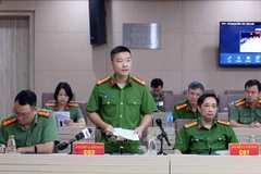 Lieutenant Colonel Vu Thanh Tung, Deputy Director of the The Police Department for Corruption, Smuggling and Economic Crimes under the Ministry of Public Security, answers questions from reporters. (Photo: VNA)