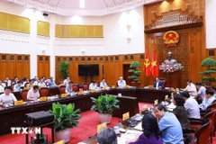 Prime Minister Pham Minh Chinh chairs meeting between standing Cabinet members and ministries, sectors, and agencies regarding decentralisation, delegation of authority, and delineation of powers associated with the implementation of the two-level local administration model. (Photo: VNA)