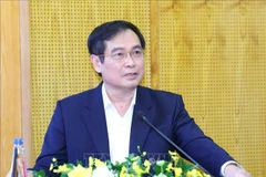 Vice Chairman of the Party Central Committee's Commission for Information, Education and Mass Mobilisation Phan Xuan Thuy speaks at the press training conference in Hanoi on December 30. (Photo: VNA)