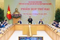 Prime Minister Pham Minh Chinh chairs the second meeting of the central steering committee for the eradication of temporary and dilapidated houses nationwide (Photo: VNA)